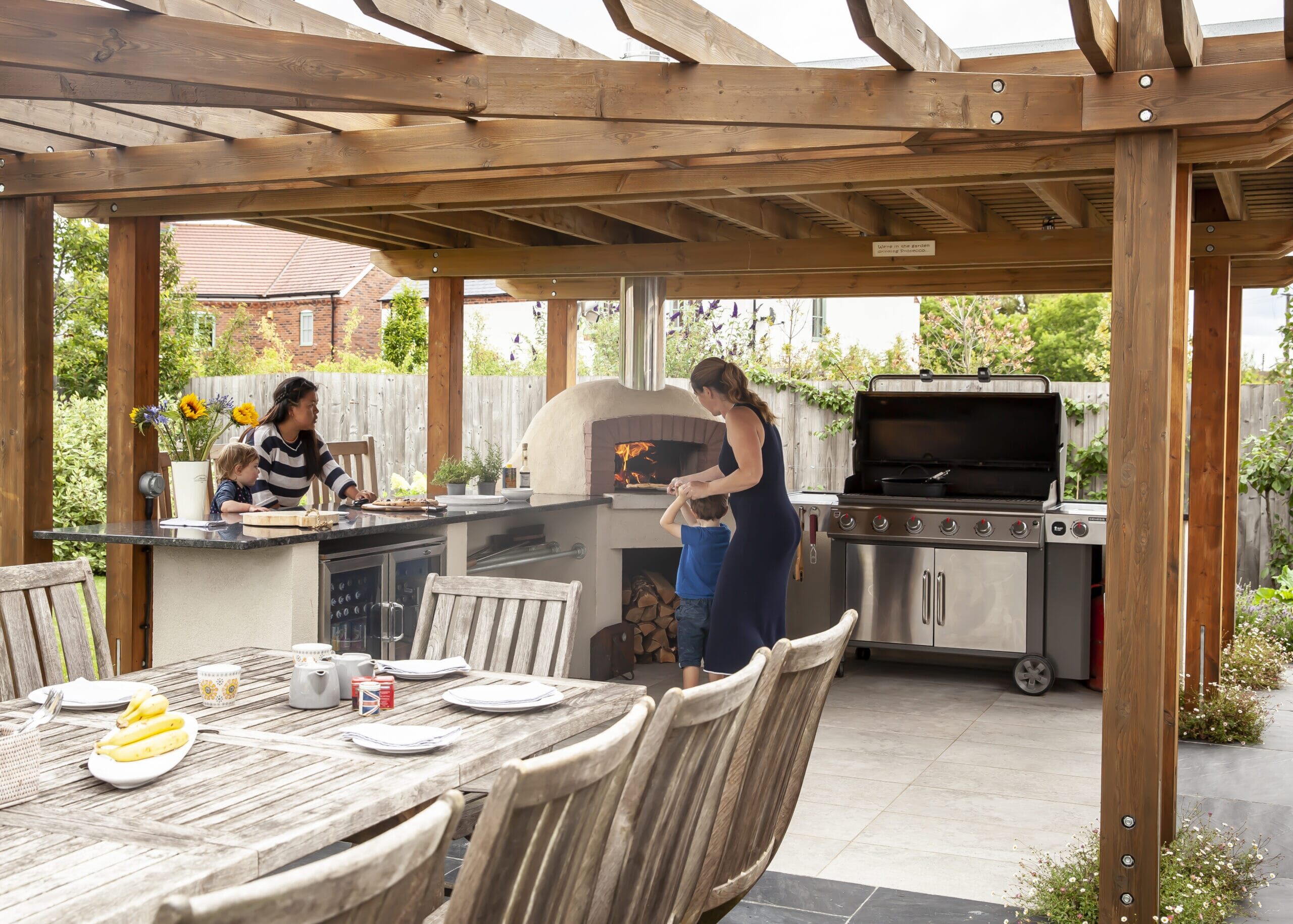 Mother and children enjoying their outdoor kitchen